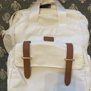 Cream Diaper Backpack with Brown Accents and Breast Pump Section
